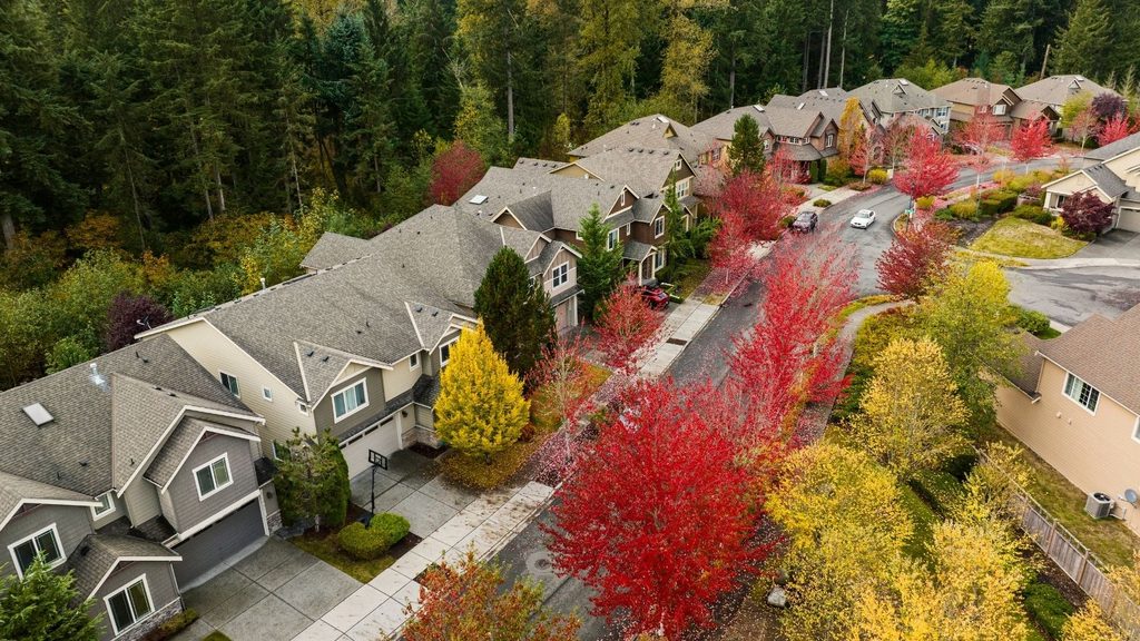 Residential neighborhood surrounded by colorful fall foliage in the Pacific Northwest.