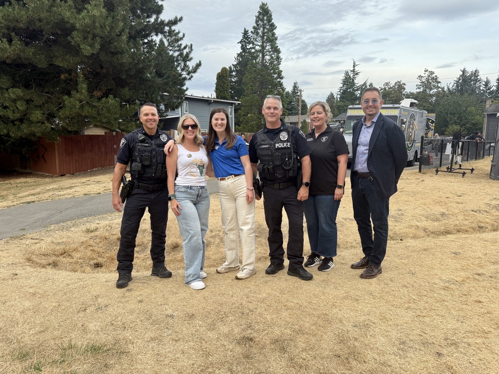 Tanya with Renton police officers at a community event